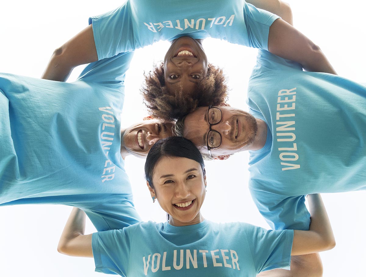 Group of happy and diverse volunteers